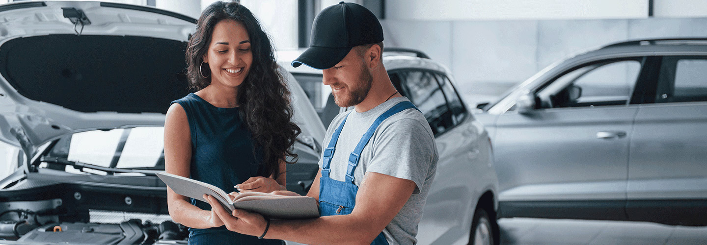 A Zeigler Plainwell Ford financial advisor going over options with a man