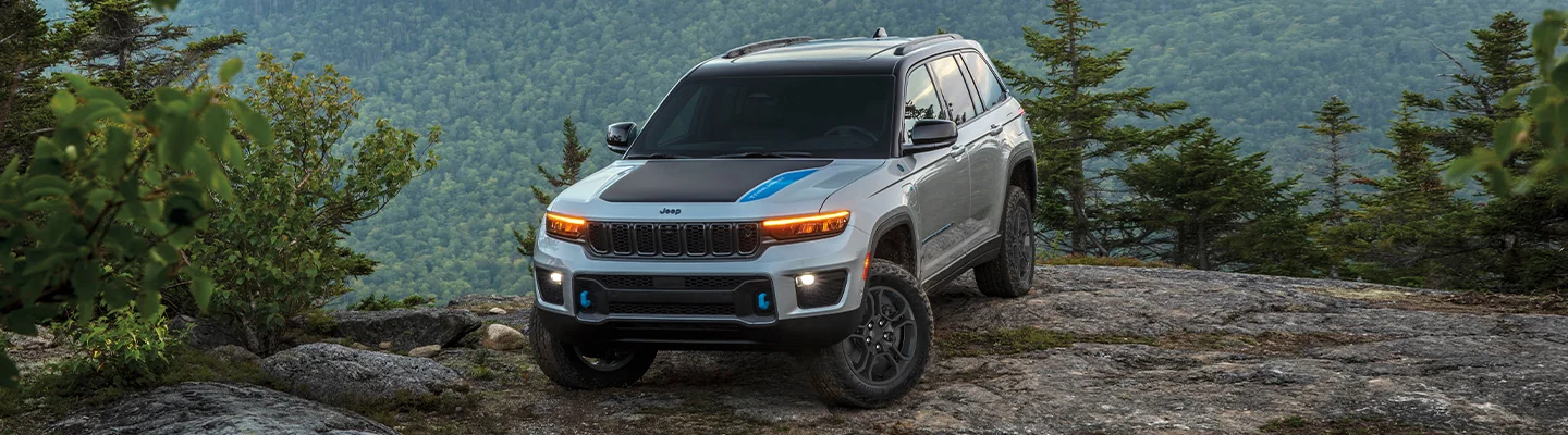 Jeep parked on top of a cliff