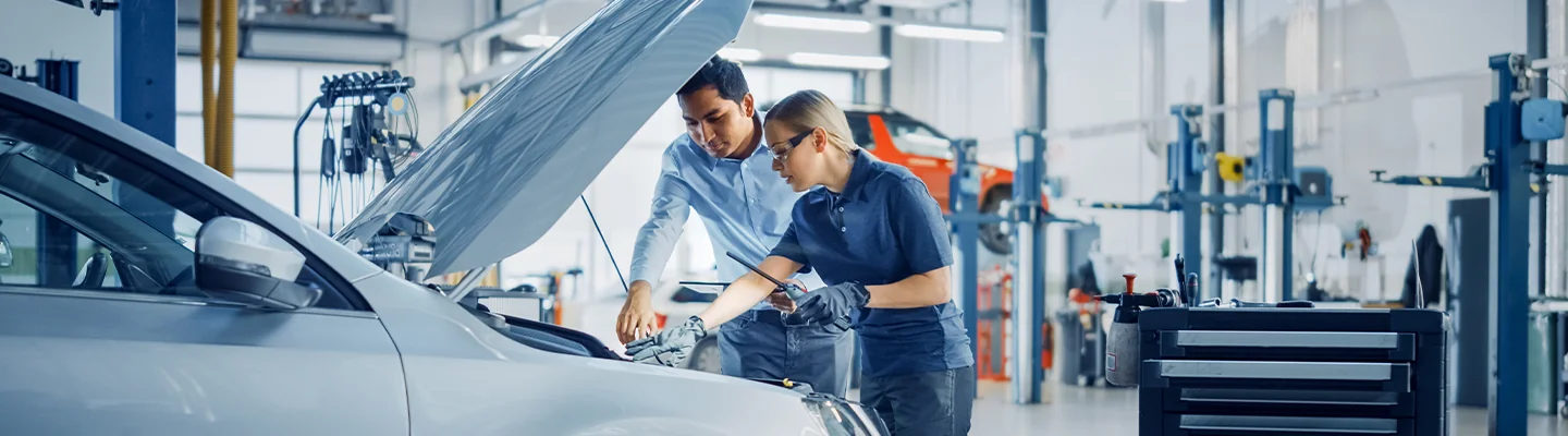 Service techs working on a car