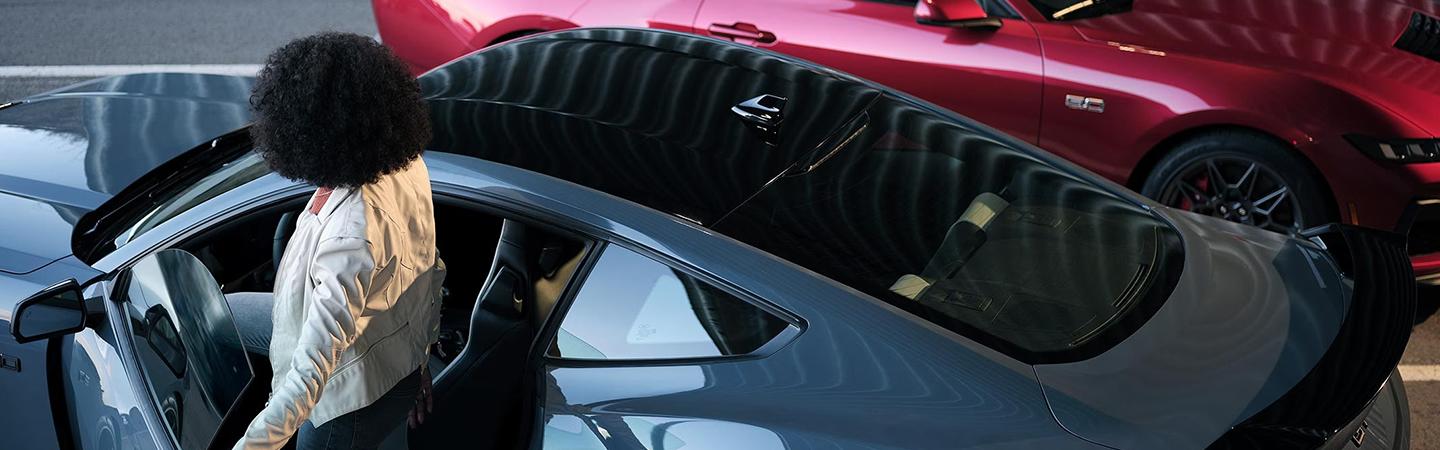 2024 Ford Mustang roof view with woman getting in car