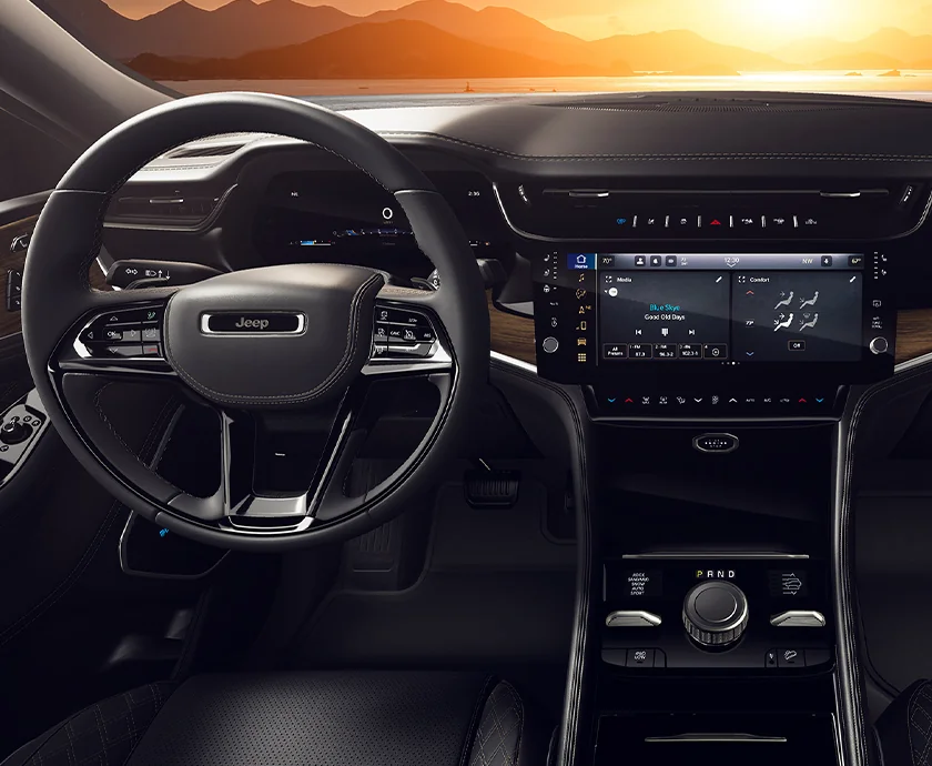 Interior view of the dashboard and tech in a 2026 Jeep Grand Cherokee