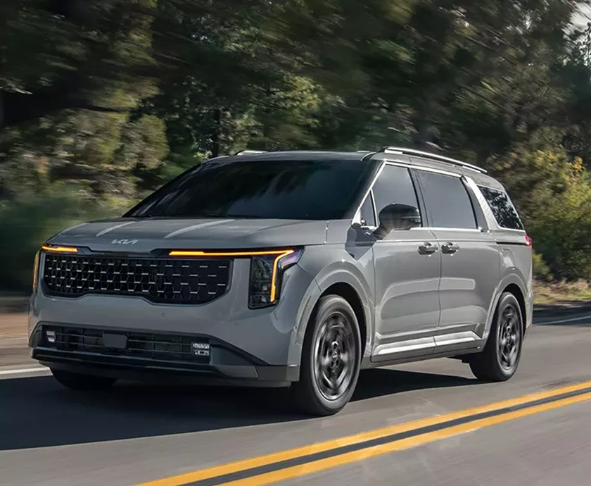 2026 Kia Carnival driving on a road