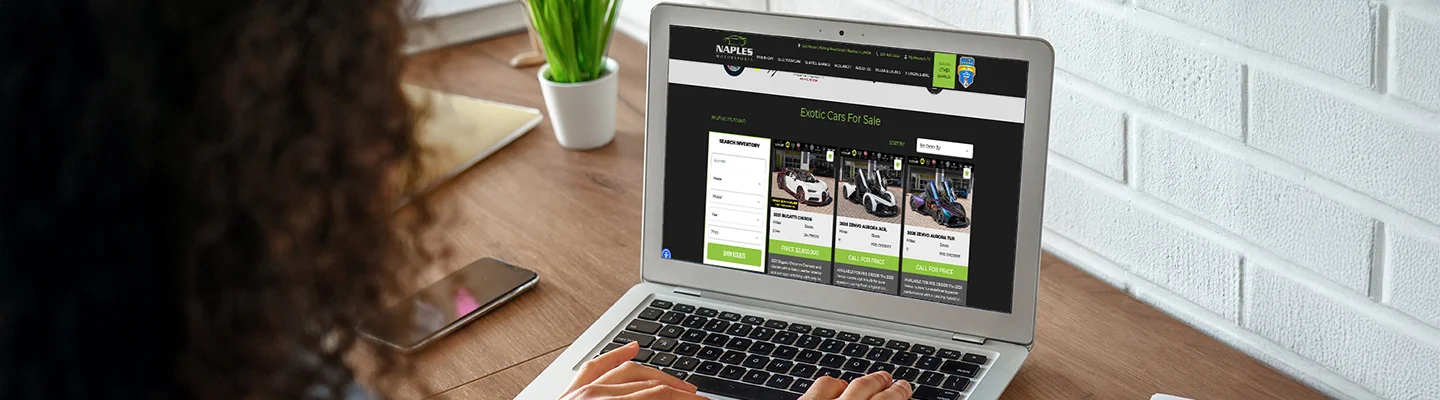 Customer shopping online at home for Exotic Cars at Naples Motorsports