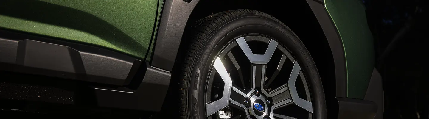 green Subaru Outback outside