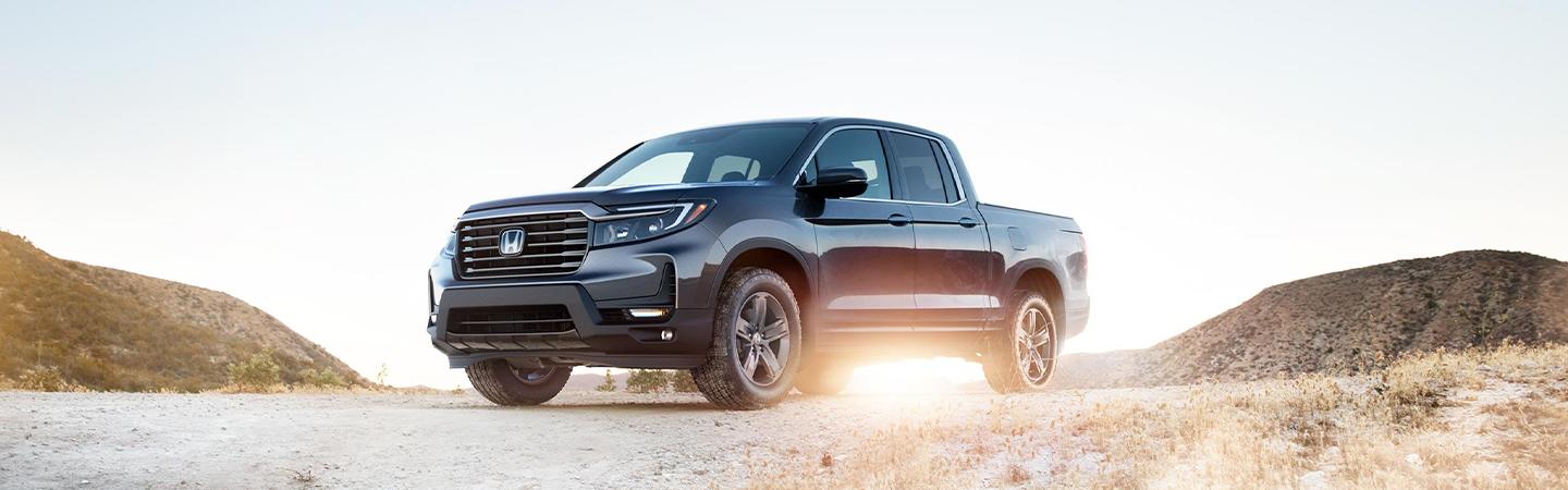2022 Honda Ridgeline parked offroad with sunset in view