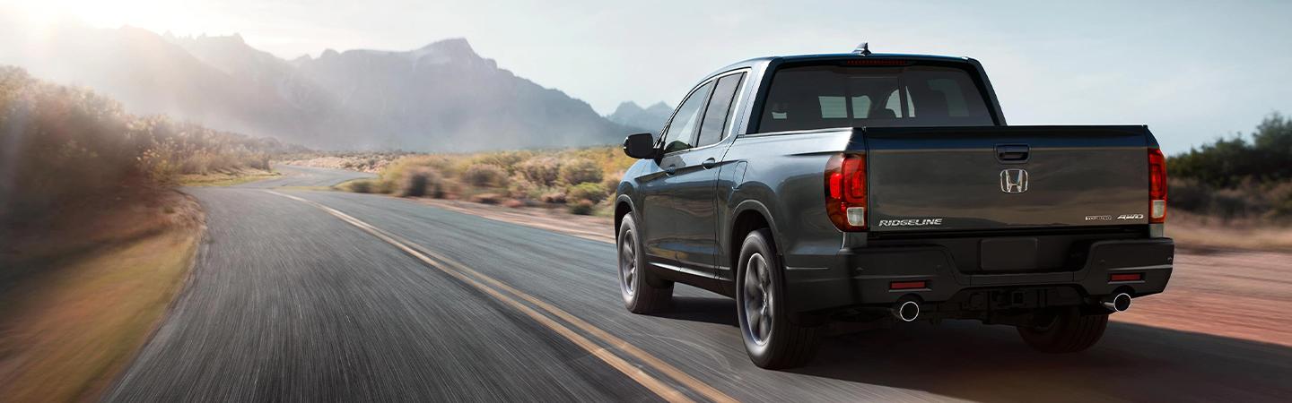 rear view black 2022 Honda Ridgeline in motion