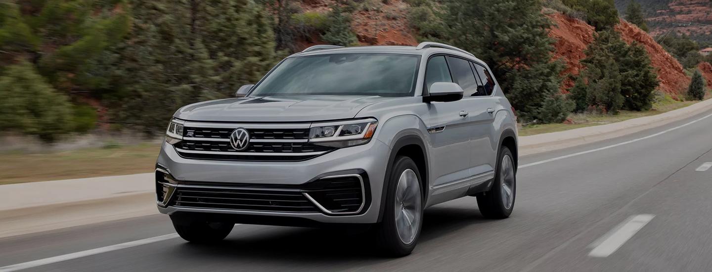 VW Atlas driving on road