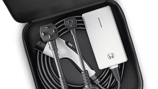 Honda portable EV charging kit with cables and adapter in carrying case