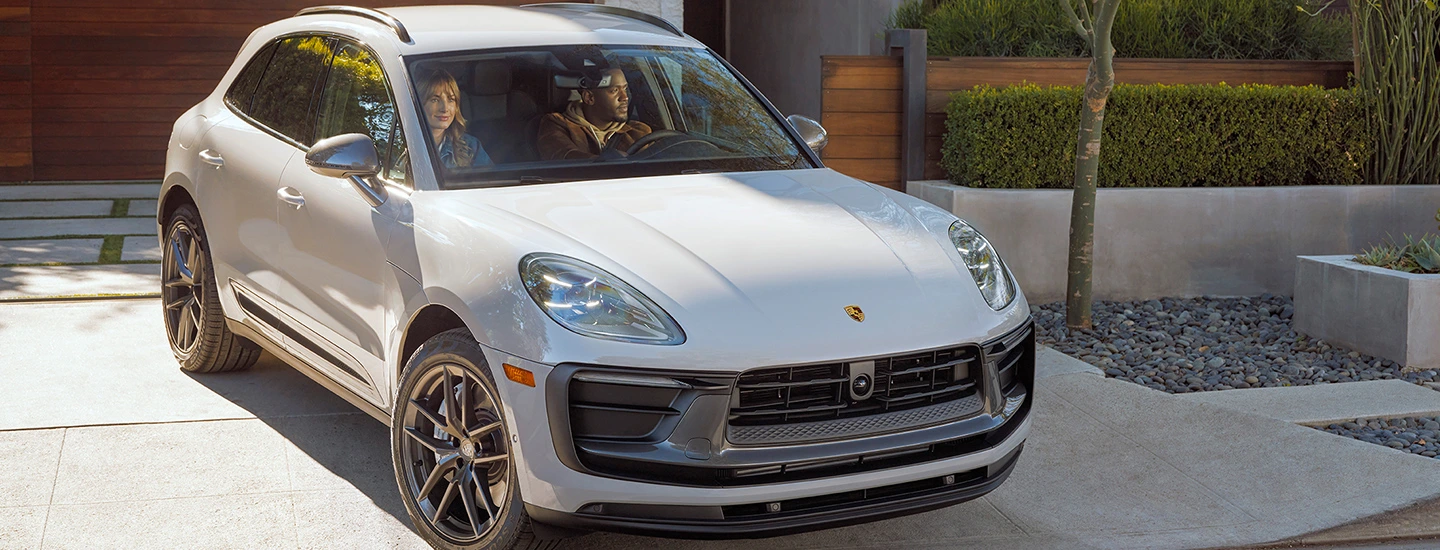 : 2024 Porsche Macan EV vs Tesla Model Y front side silver