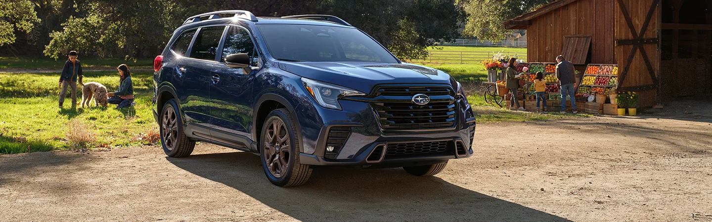 2025 Subaru Ascent vs Toyota Highlander Blue color front view
