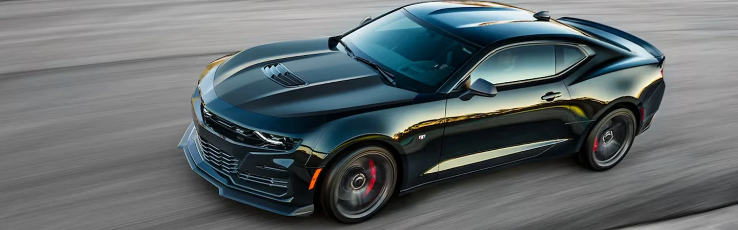 Top side vier of a black 2024 Chevrolet Camaro driving