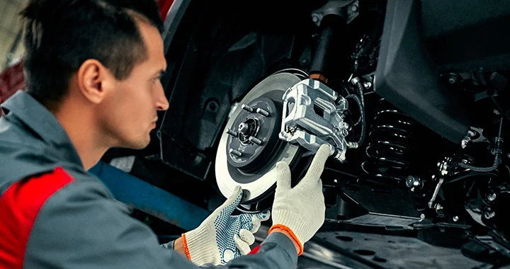 mechanic working on brakes