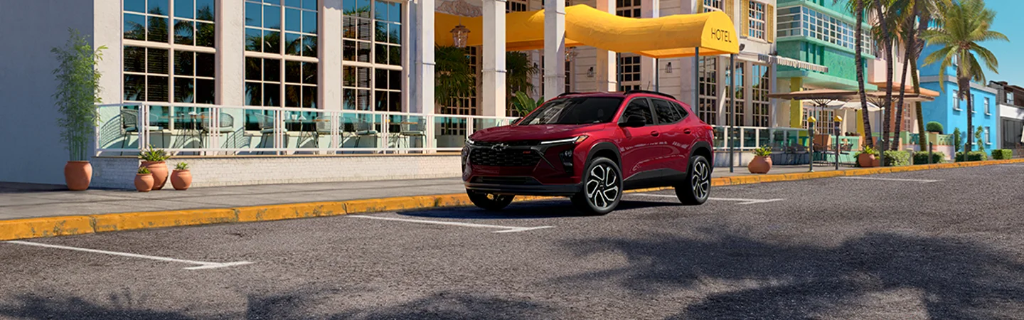 Red 2025 Chevrolet Trax parked on a city street