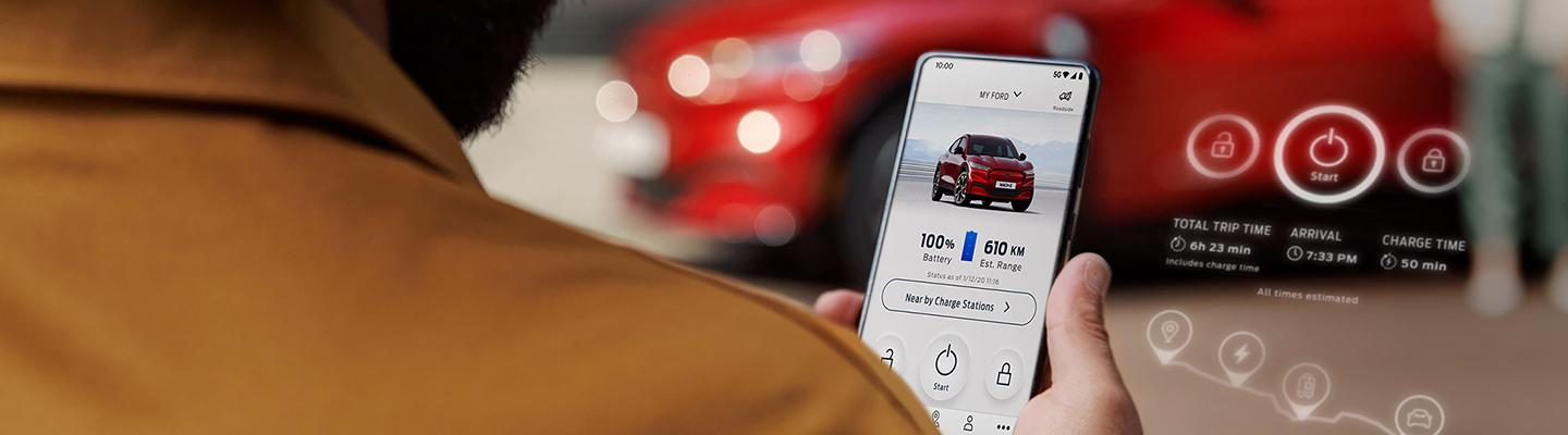 Person holding a cell phone with the FordPass app displayed