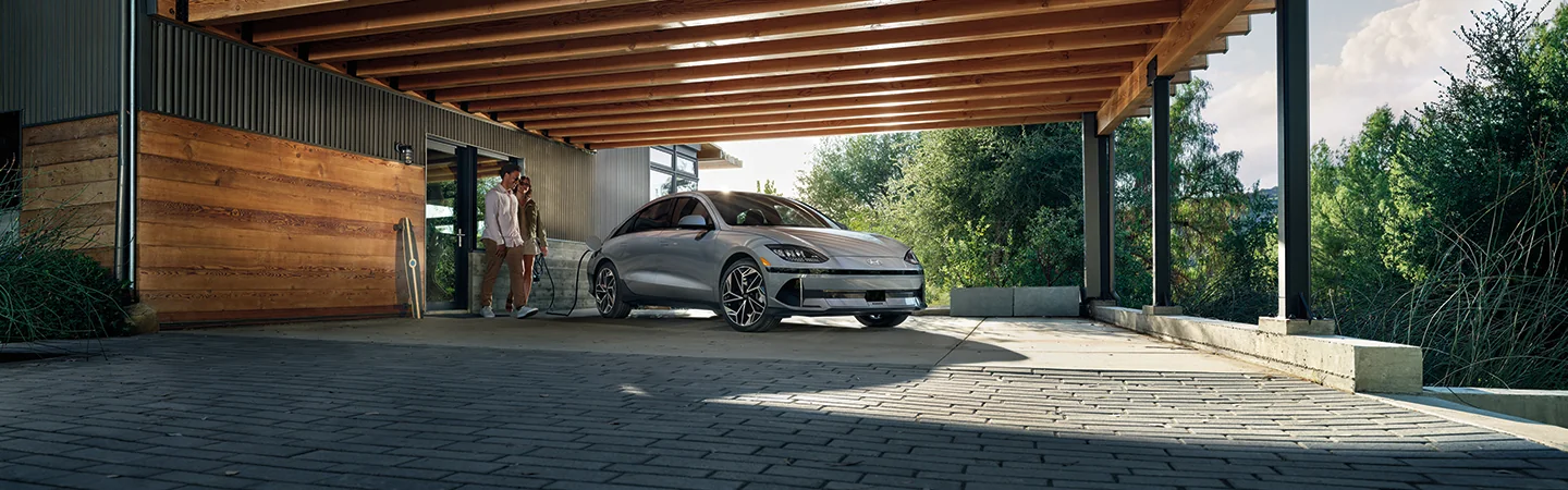 man and woman looking gray 2025 Hyundai IONIQ 6