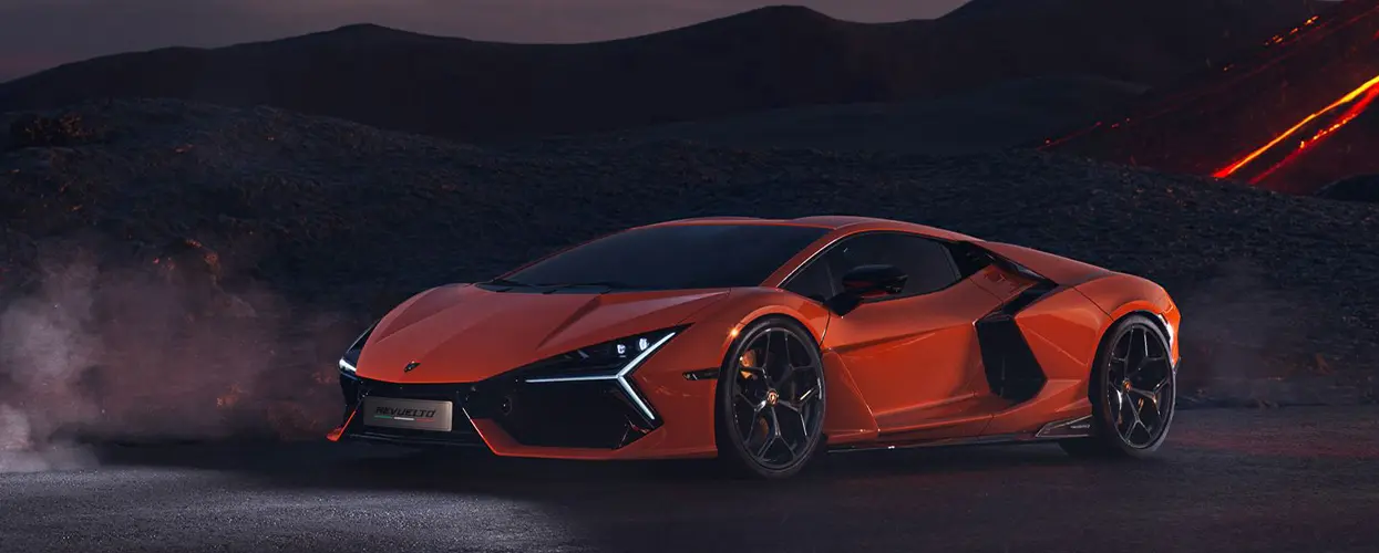 new Lamborghini near hills at dusk