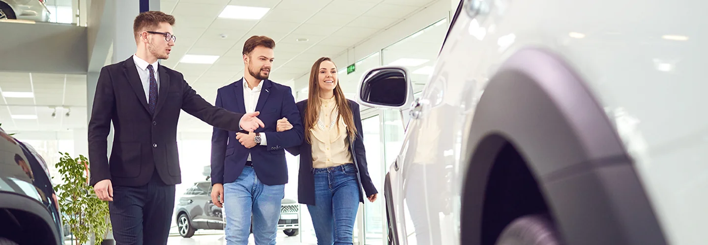 Sales person showing customers new cards