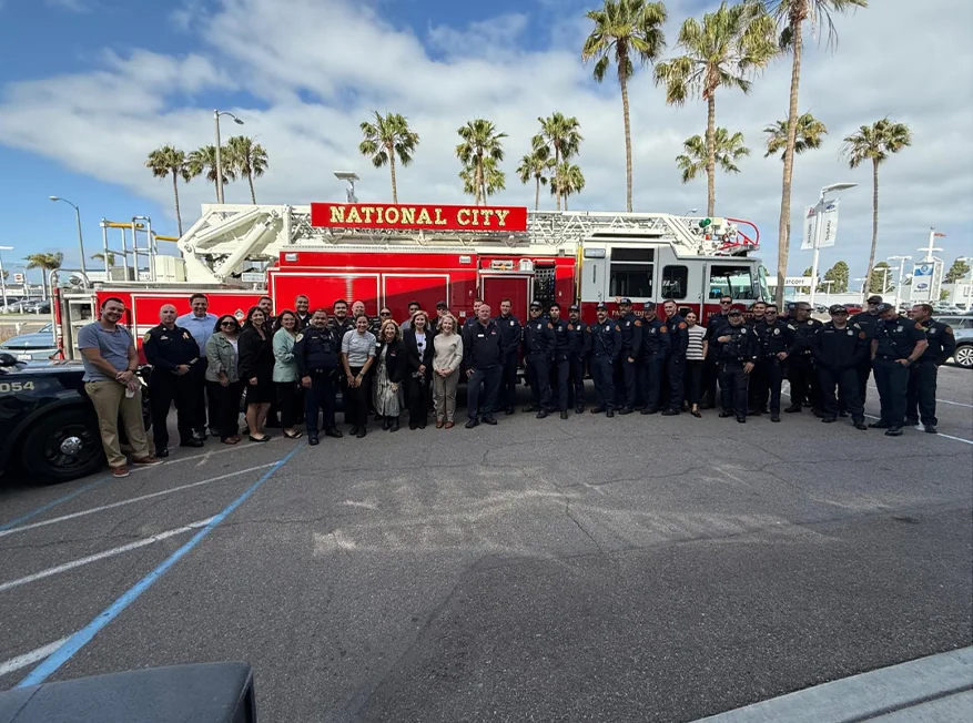 Fire Fighters standing in front of a fire truck