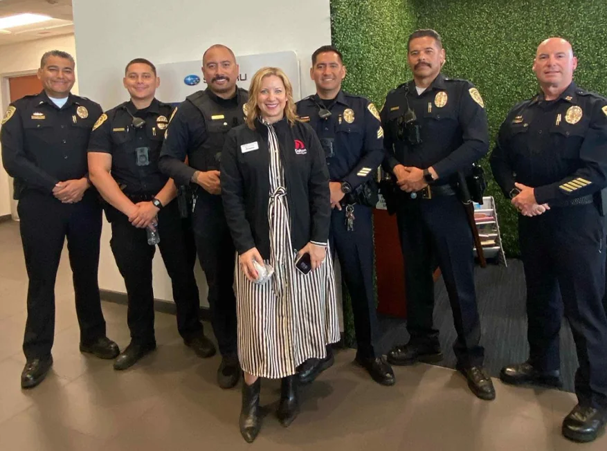 Fire Fighters standing for a photo in an office