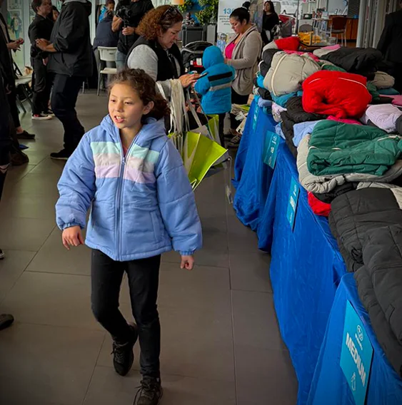 girl chosing new coat