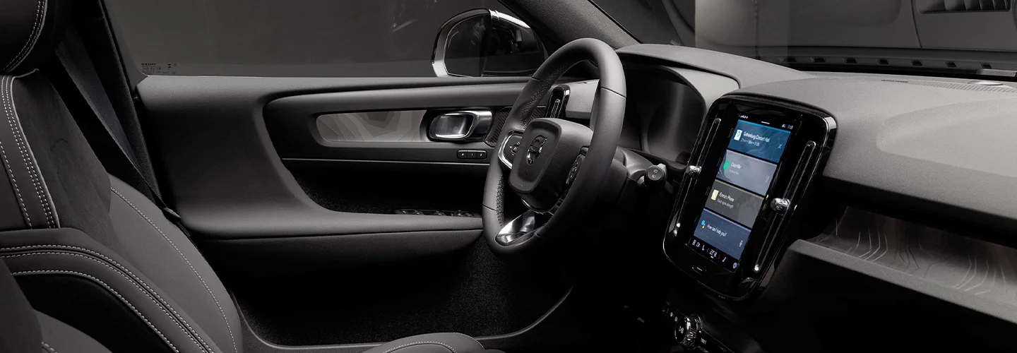 Interior view of the front seat and tech in a 2025 Volvo XC40