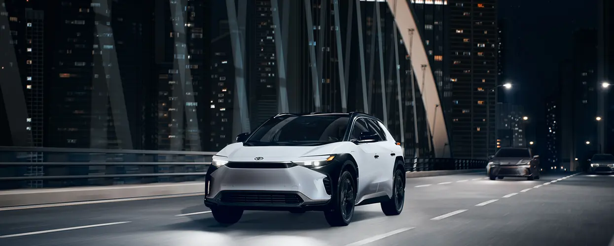 2026 Toyota RAV4 Hybrid driving past farm