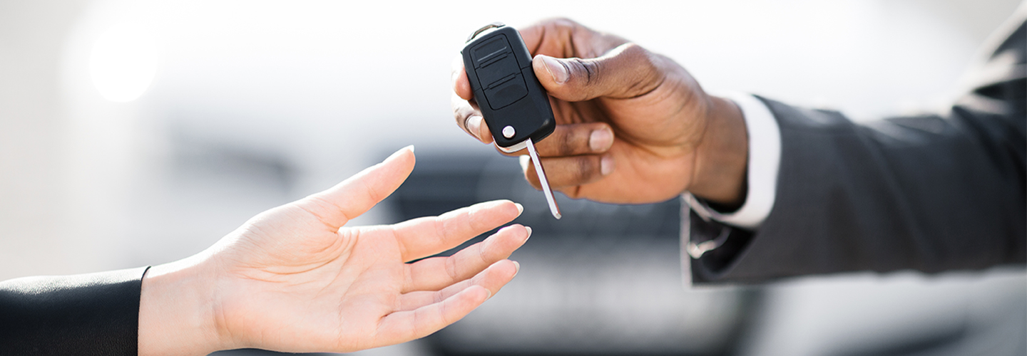 vehicle keys being handed