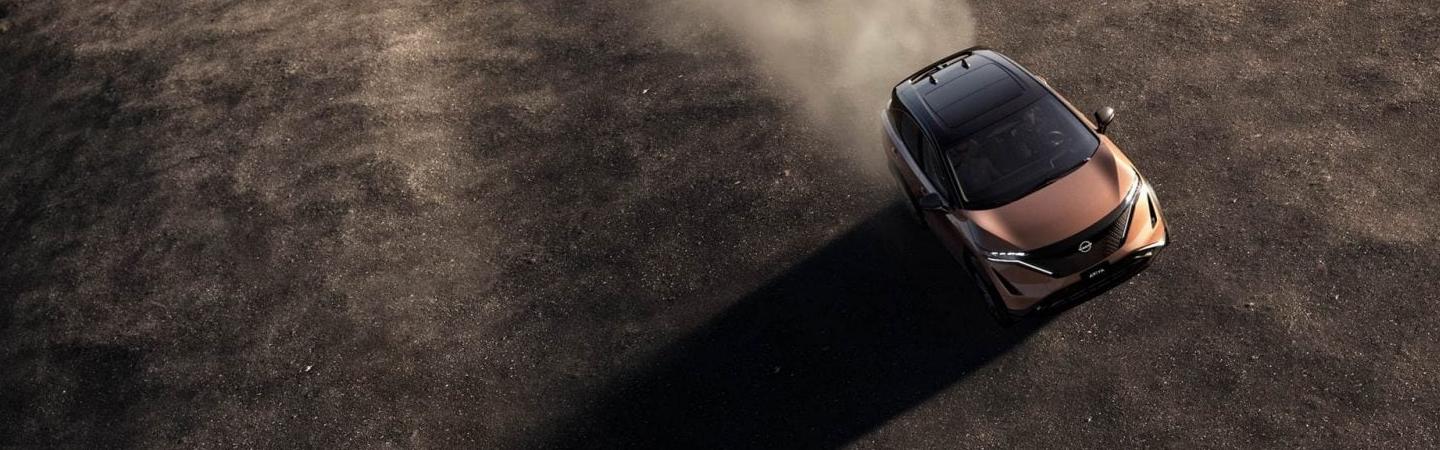 Top view of a 2022 Nissan Ariya driving in the dirt