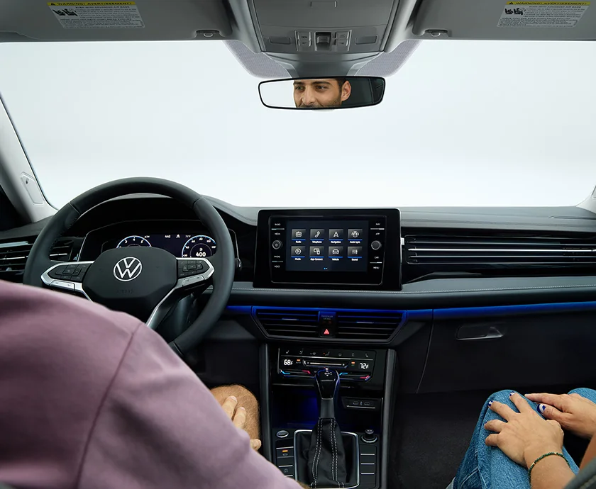 Interior view of the front seat dashboard and tech of a 2026 Volkswagen Jetta