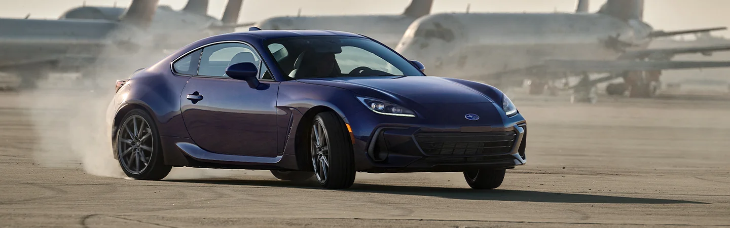 A purple 2025 Subaru BRZ smoking tires on a airport tarmack in Chattanooga, TN.