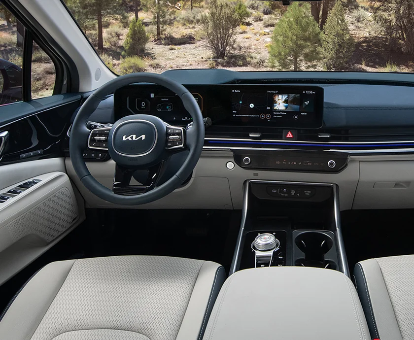 Interior view of the front seat and dashboard of a 2026 Kia Carnival