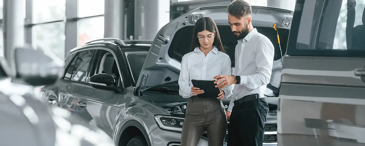 people reviewing tablet in showroom
