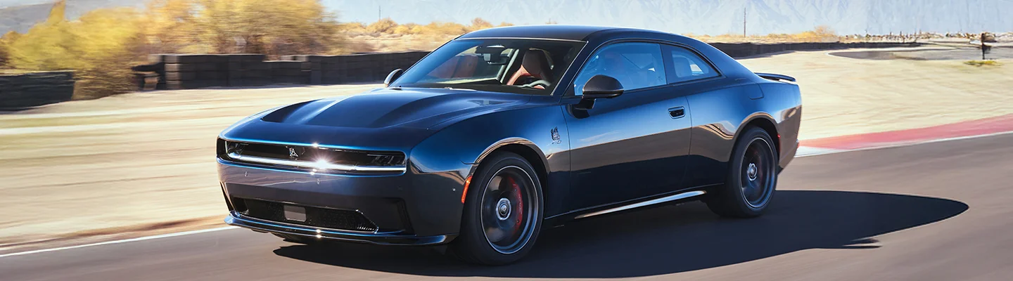 2025 Dodge Charger EV driving on a desert road