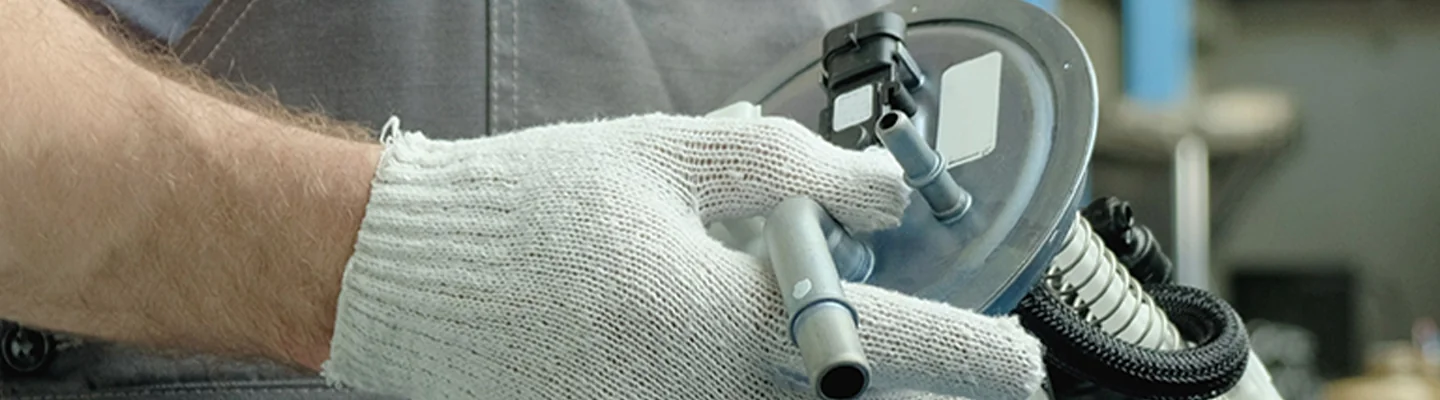 auto mechanic working with Get Genuine Kia Parts at Kia of Leesburg