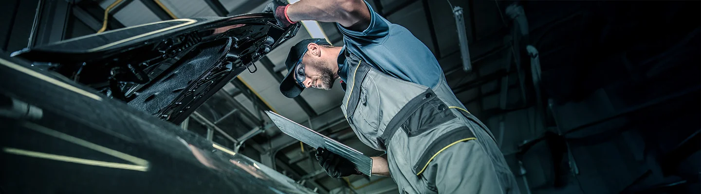 auto mechanic working on car
