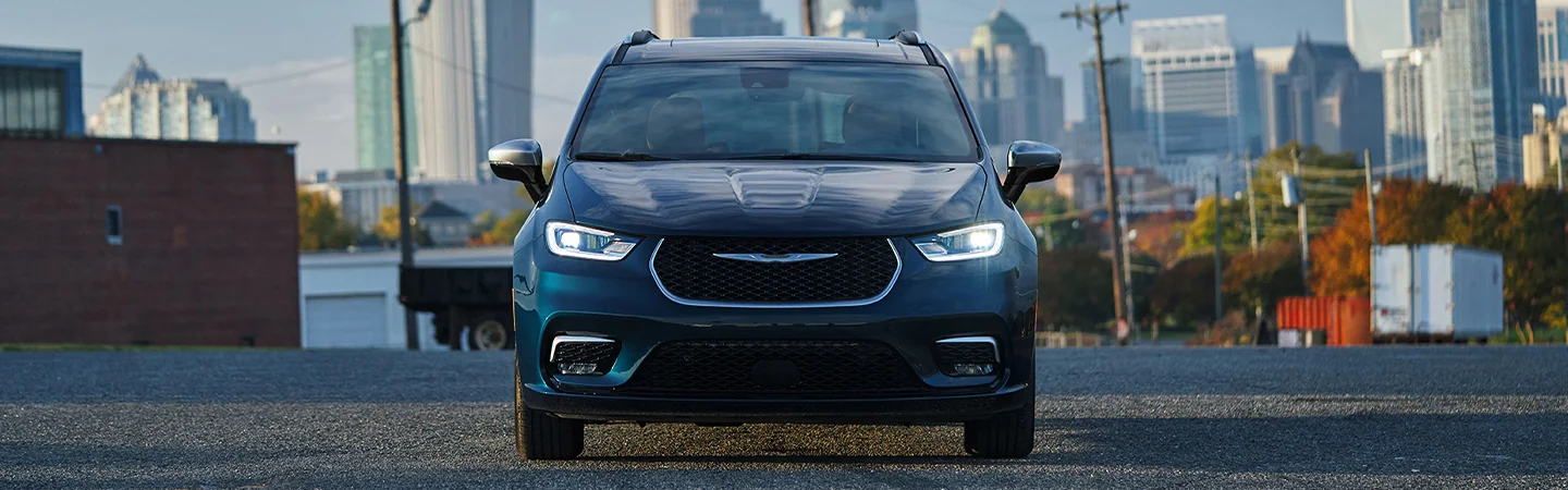 2025 Chrysler Pacifica Specs blue color car stand on city