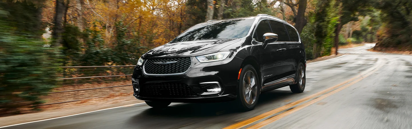 2025 Chrysler Pacifica Specs black color car stand on road