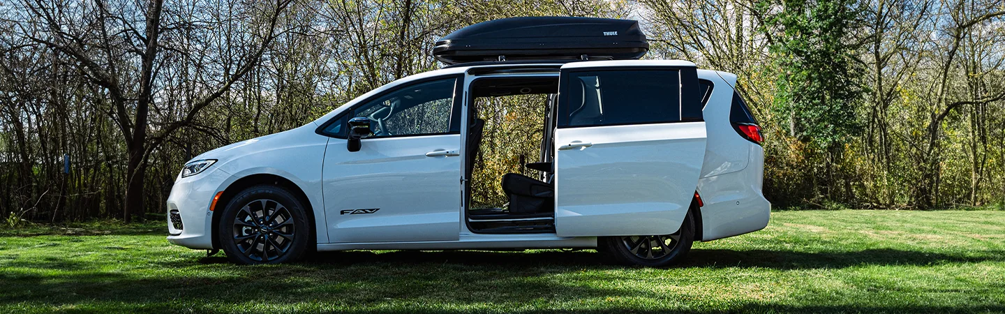 2025 Chrysler Pacifica White color car on grass side View