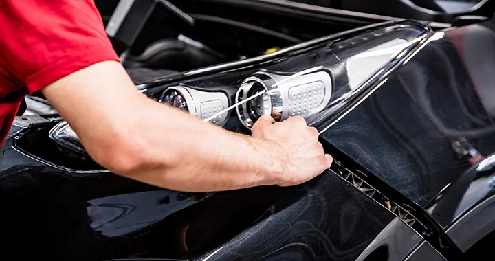 Service technician working on a vehicle