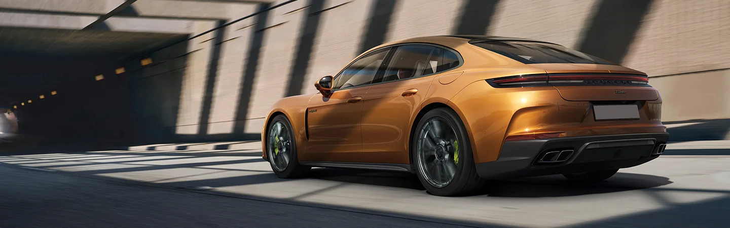 rear view of a gold 2026 Porsche Panamera 4 E-Hybrid
