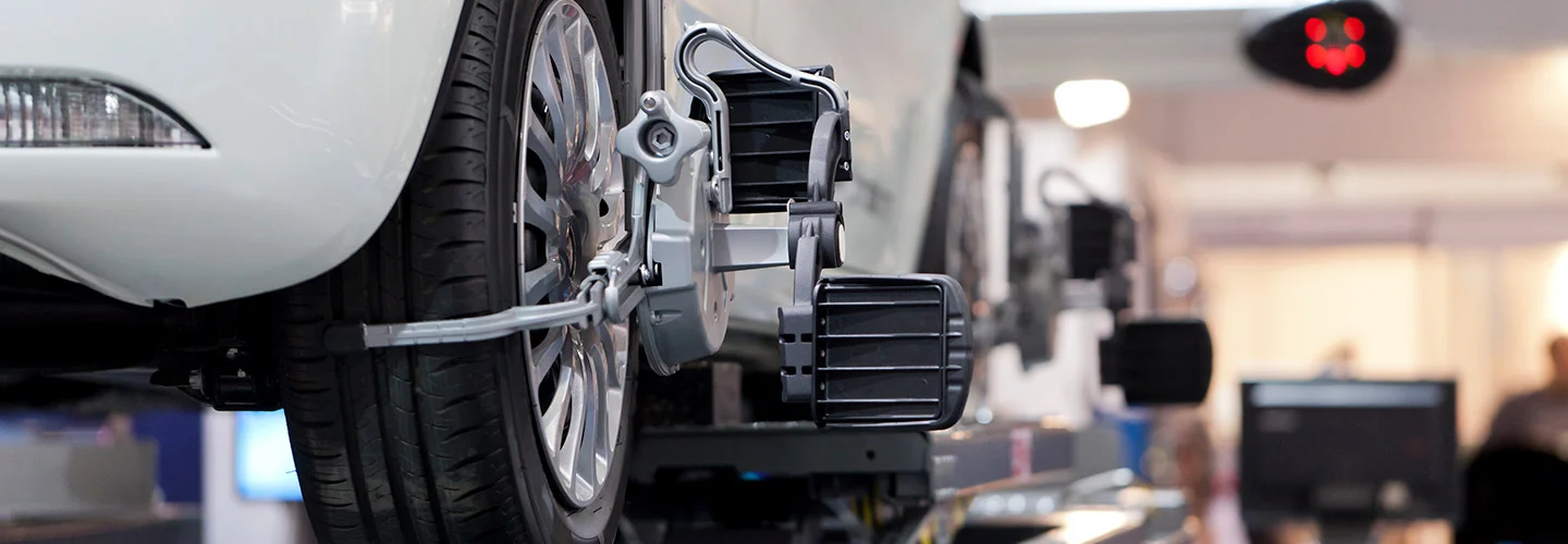 closeup car up on lifts for tire rotation