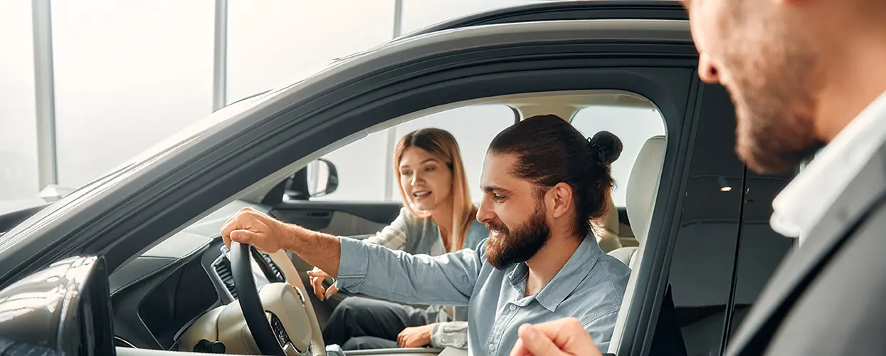 people car shopping in showroom