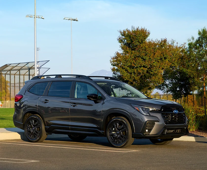 Side view of a parked 2026 Subaru Ascent at a baseball field 