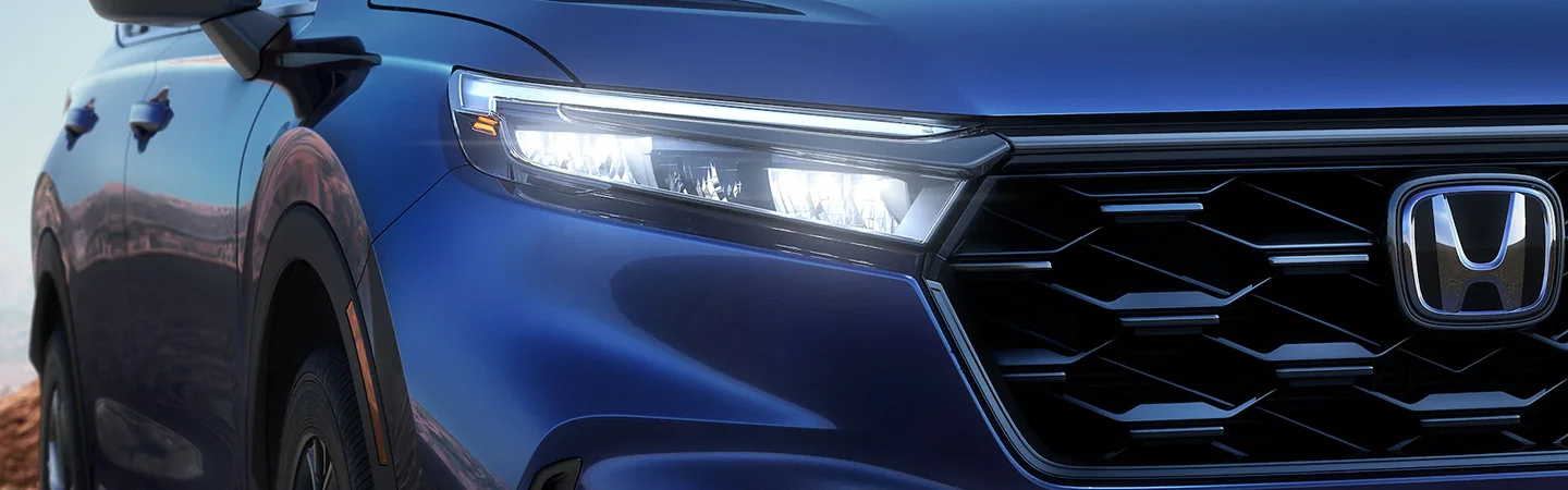 Close up of the grill of a blue 2025 Honda CR-V