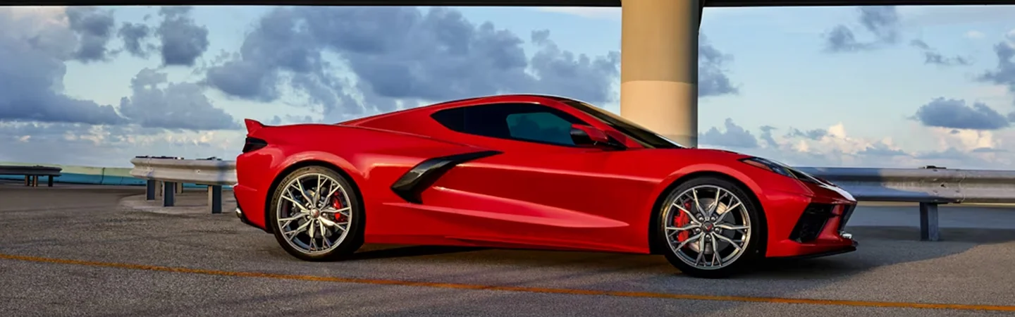 A parked red 2024 Chevrolet Corvette Stingray on a road