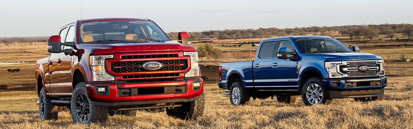 2 Ford Trucks on a farm