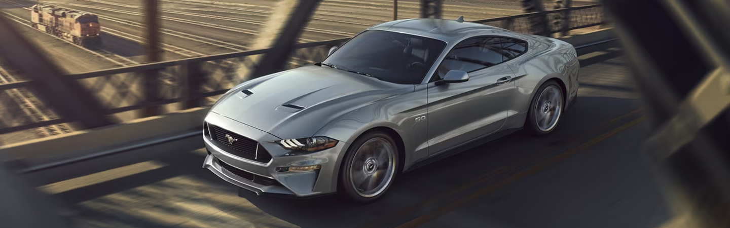 2023 Ford Mustang driving over bridge