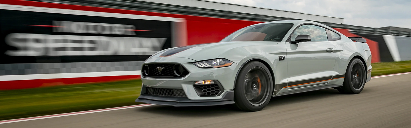 2023 Ford Mustang racing on a speedway