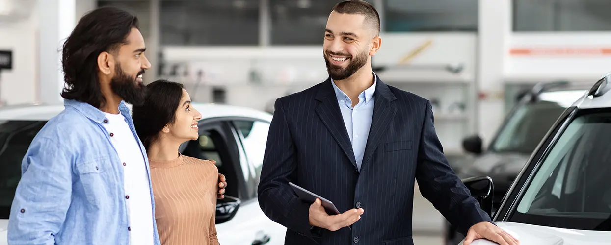 people car shopping in showroom