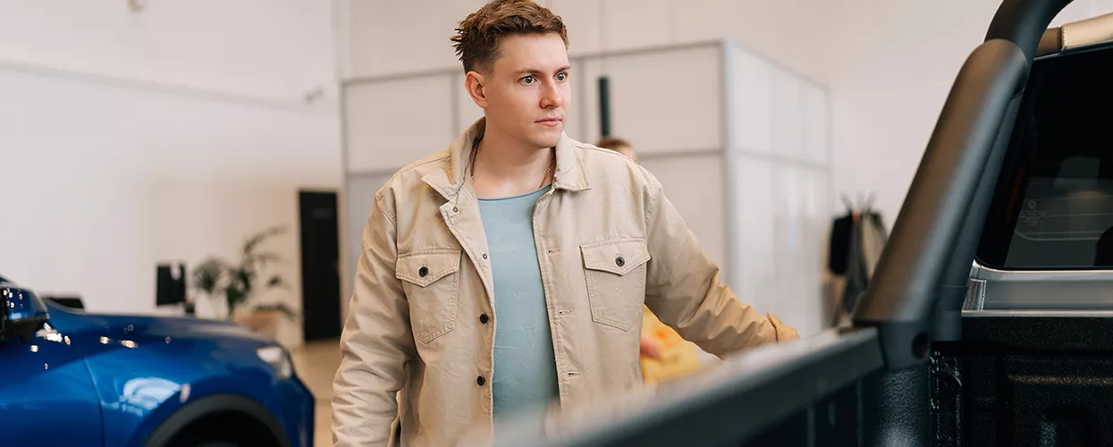 Customer walking through a GMC dealership